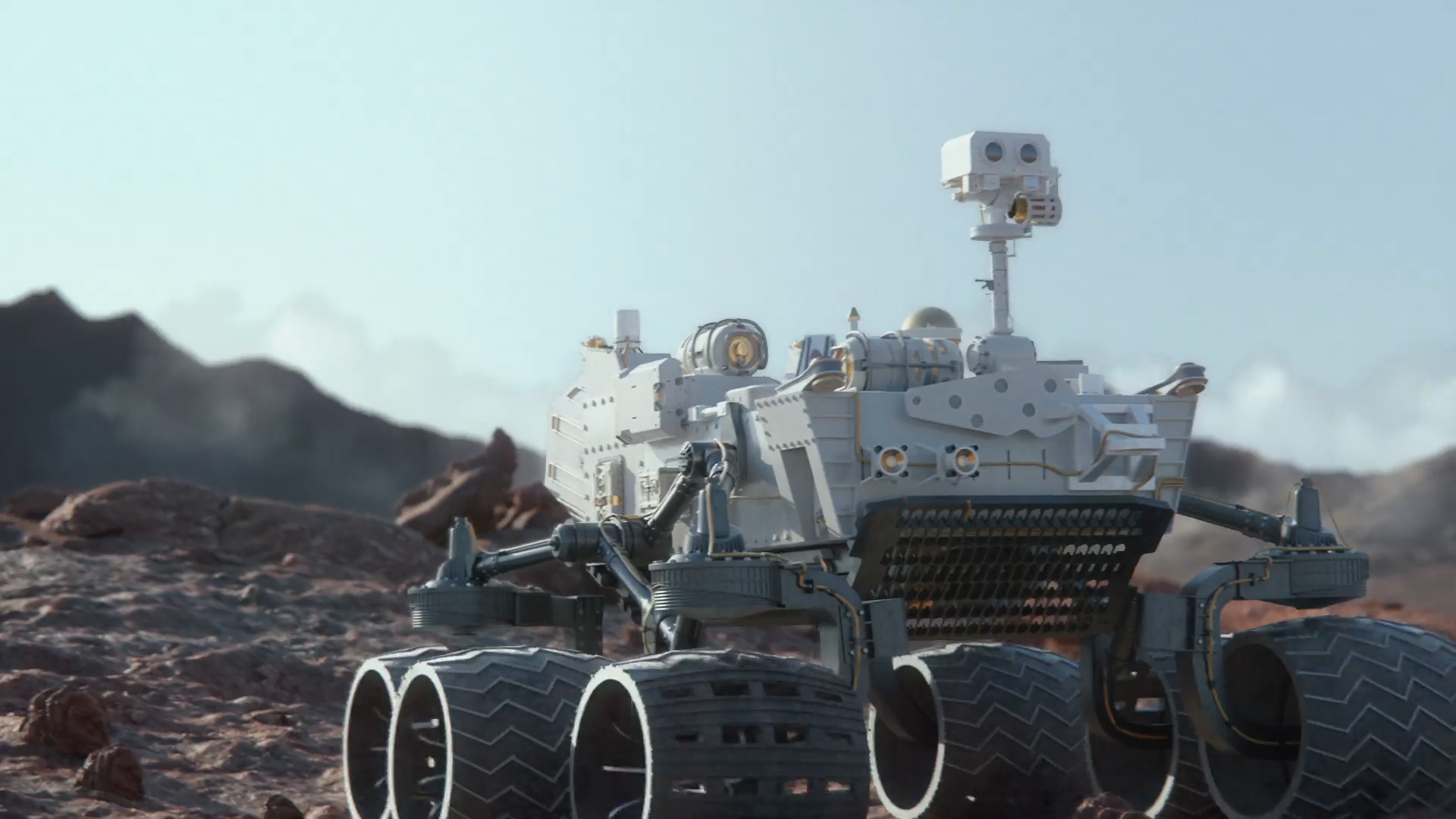 IMA_Gallery_03 A robotic rover navigating rocky terrain under bright daylight.