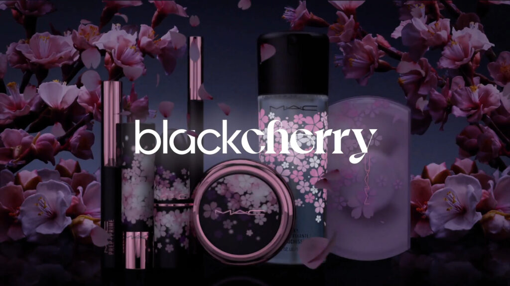 A group of MAC Black Cherry makeup products with pink floral patterns on a dark background under a white "blackcherry" title.