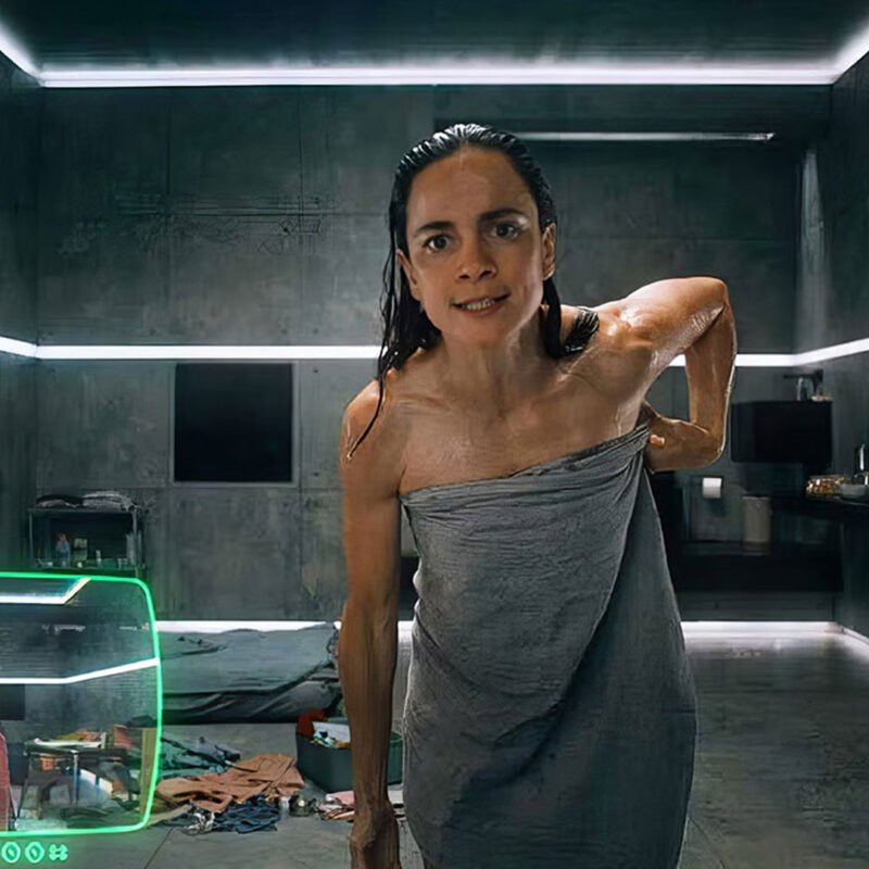 Actress Alice Braga in a futuristic surveillance room scene from the sci-fi film SHARE?
